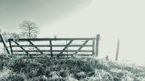 Snow covered field against sky