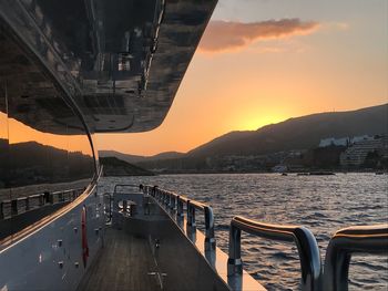 Panoramic view of bridge over sea against sky during sunset