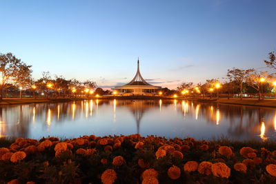 Scenic view of lake against sky at dusk