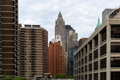 Modern buildings in city against sky