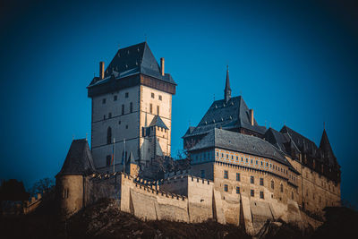 Low angle view of historical buildings against blue sky