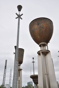 Low angle view of street light against sky