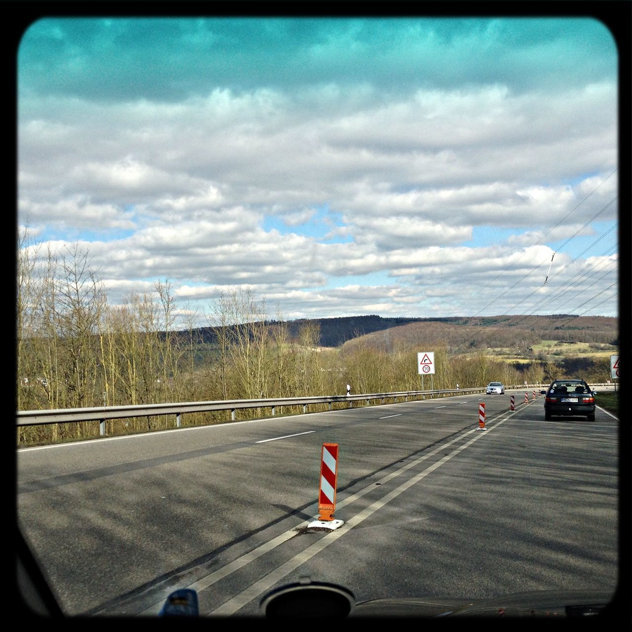 transportation, transfer print, road, road marking, sky, car, cloud - sky, land vehicle, mode of transport, auto post production filter, cloudy, cloud, country road, on the move, street, the way forward, travel, highway, landscape, windshield