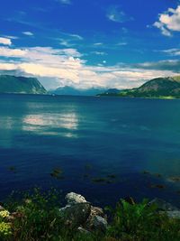 Scenic view of sea against blue sky