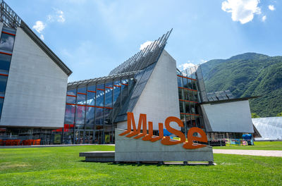 Built structure on field against sky