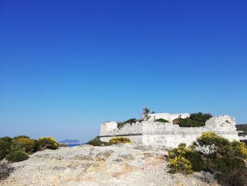 View of castle against clear blue sky