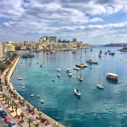 High angle view of boats moored in sea against sky