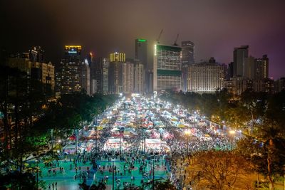 High angle view of illuminated city buildings at night