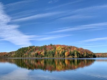 Scenic view of lake against sky during autumn