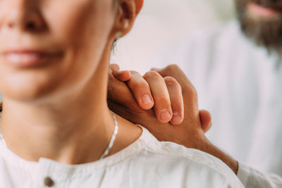 Woman enjoying shiatsu neck and shoulders massage.