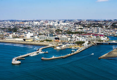 High angle view of sea against buildings in city