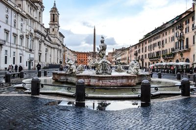 Water fountain with buildings around