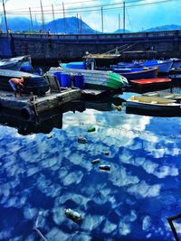 Boats moored at harbor