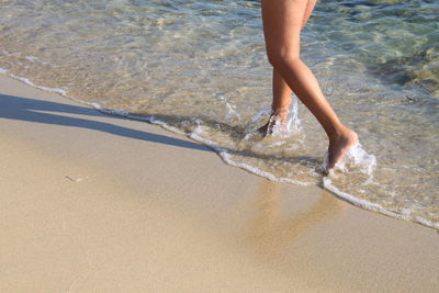 Low section of person on beach