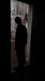 View of woman in the dark