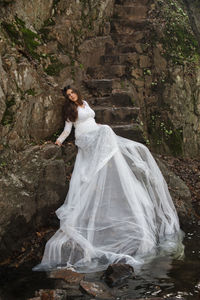 Woman standing on rock