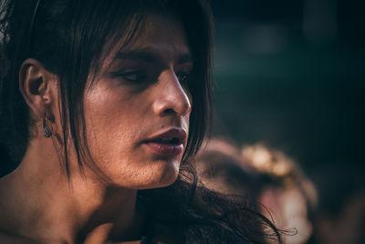 Close-up of shirtless young woman