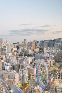 High angle view of buildings in city against sky