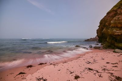 Scenic view of beach against sky