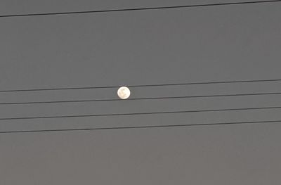 Low angle view of light bulb against sky