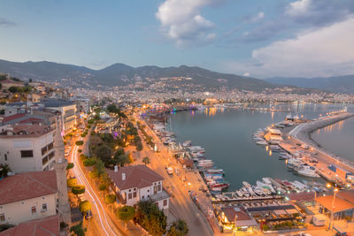 High angle view of city by sea against sky