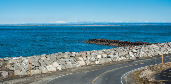 A view of a shoreline road and water in westport, washington..