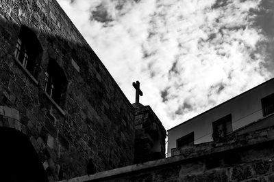 Low angle view of old building against sky