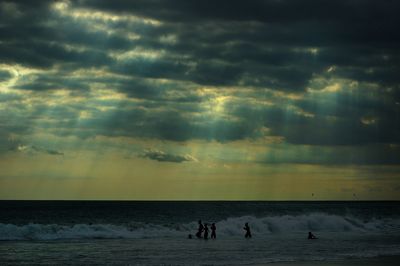 Scenic view of sea against cloudy sky