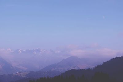 Scenic view of mountains against sky at night