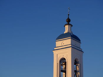 Low angle view of building against clear blue sky