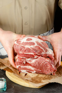 Midsection of man preparing food