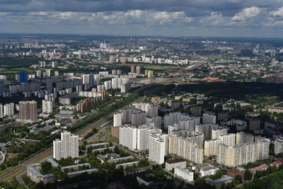 High angle view of modern buildings in city against sky