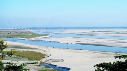 Scenic view of beach against clear sky