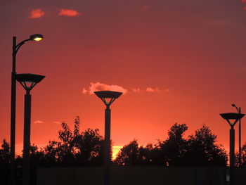 Silhouette of street light against sky during sunset