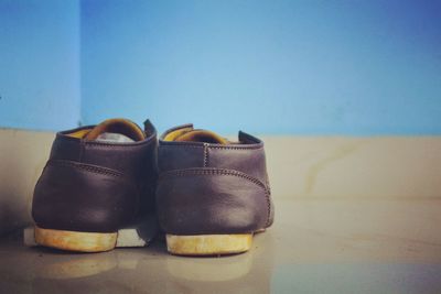 Close-up of shoes on table