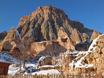 Panoramic view of snowcapped mountains against clear sky