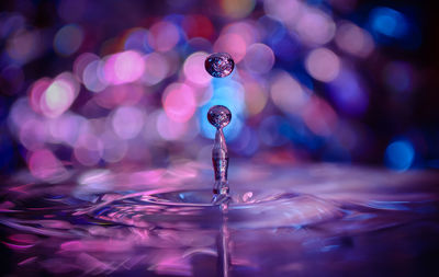 Close-up of drop falling in water