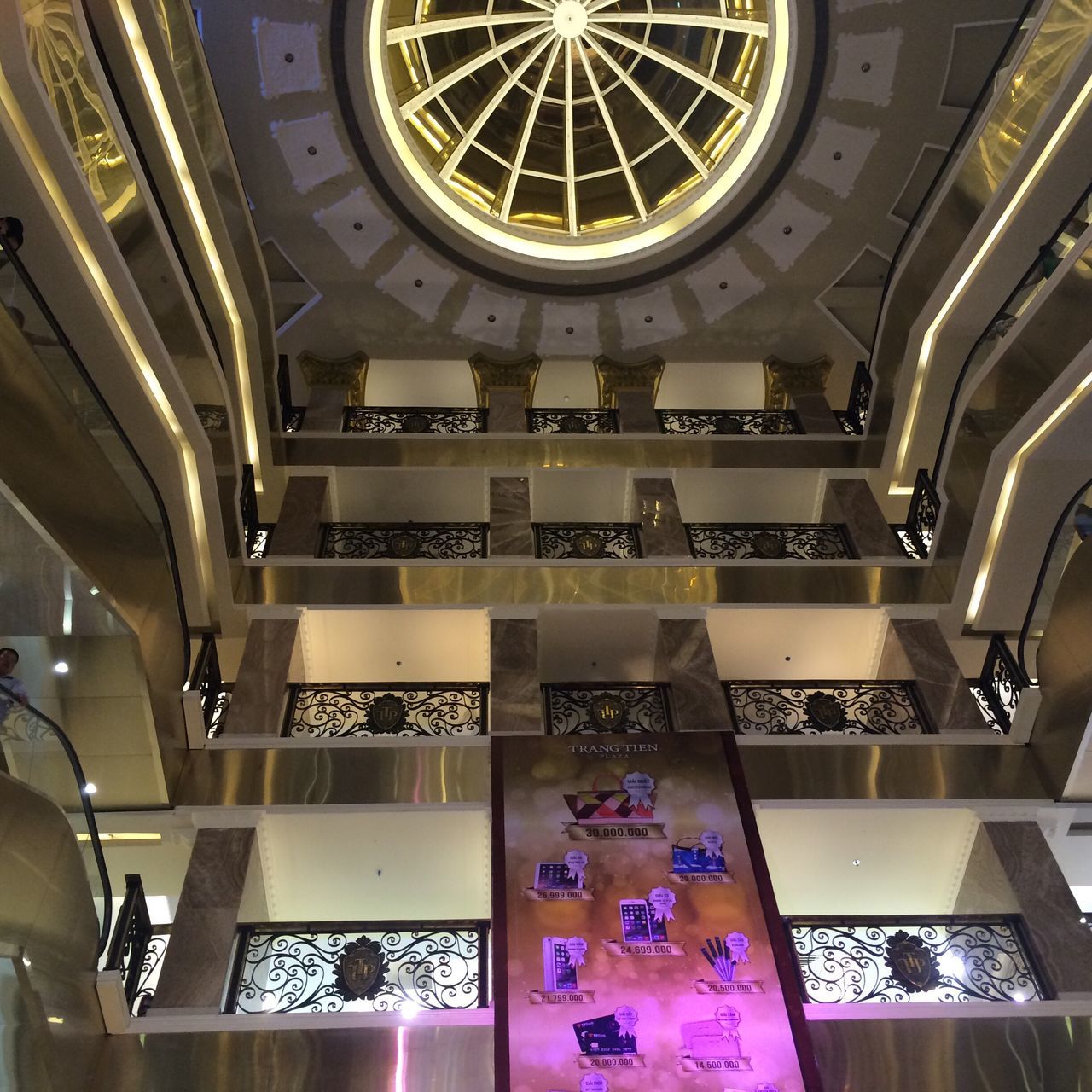 indoors, architecture, low angle view, ceiling, built structure, skylight, window, architectural feature, interior, pattern, church, place of worship, glass - material, design, no people, religion, building, ornate, day, staircase