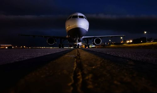 Airplane on road at night