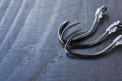 High angle view of fishing hooks on table