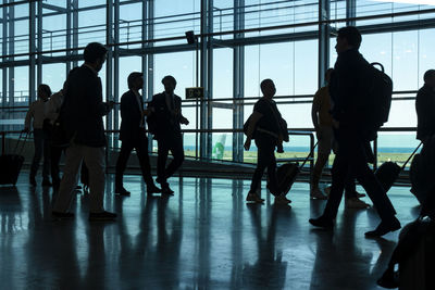 Silhouette of passengers at departure terminal in international airport