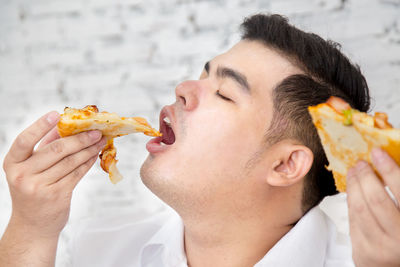 Close-up of man eating food