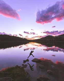 Scenic view of lake against sky at sunset