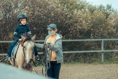 Woman riding horse