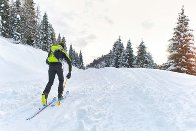 Full length of person skiing on snow covered mountain