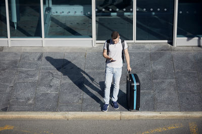 Full length of man walking on road