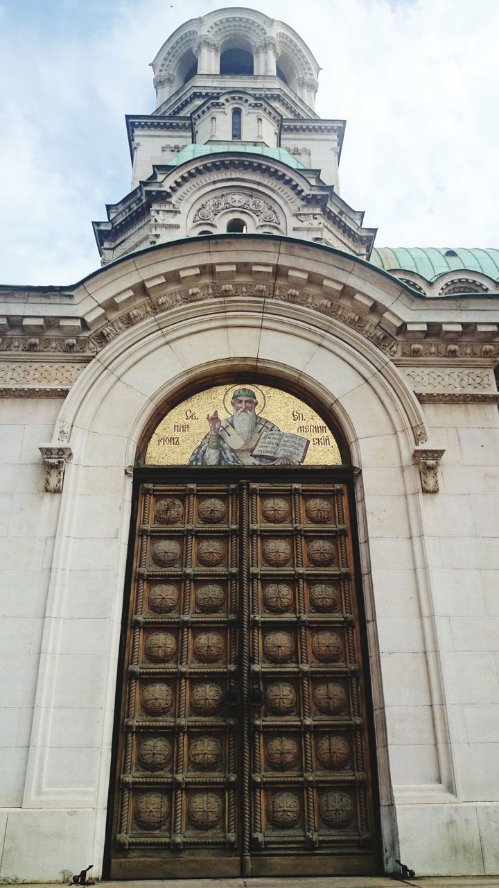 LOW ANGLE VIEW OF TEMPLE AGAINST BUILDING