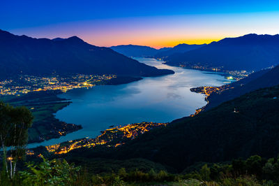 Lake como, photographed by gera lario, in the evening. view of towns and the upper lake mountains.