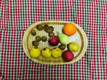 High angle view of fruits in plate on table