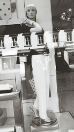 Young woman standing in store
